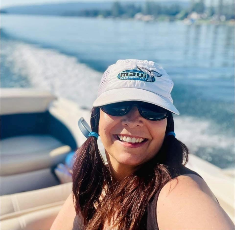 Donna from Rebuild With Clarity enjoying the results of her unique goal setting method on her boat.