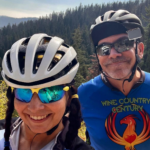 Smiling in cycling gear outdoors, representing the journey to reinvent yourself after 50.